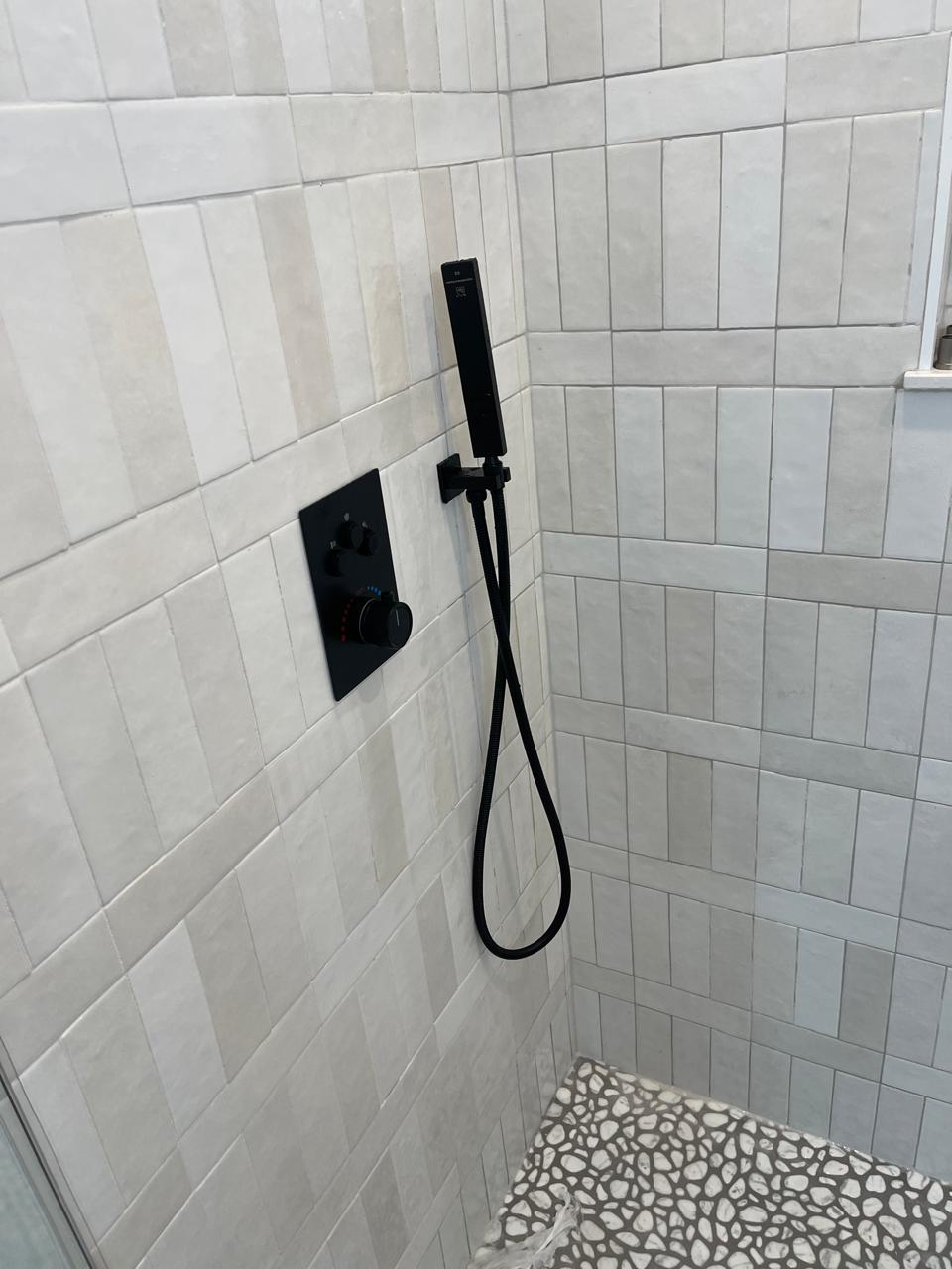 Finished bathroom - valve and handshower fixture installation