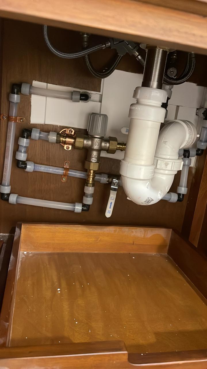 P-trap and valve finish plumbing connection under bathroom sink