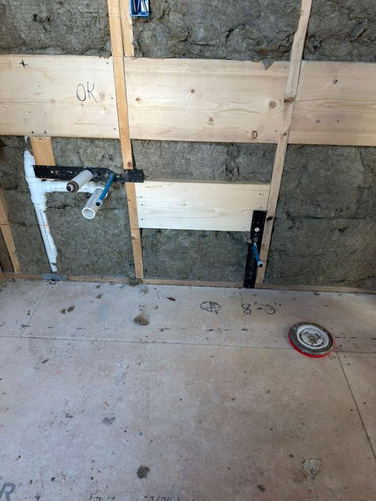 Bathroom rough plumbing for sink and toilet installation