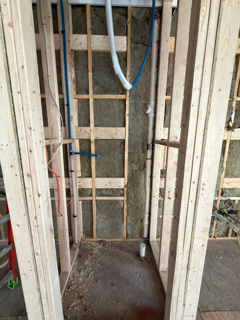Water heater rough plumbing with main hot and cold lines installation